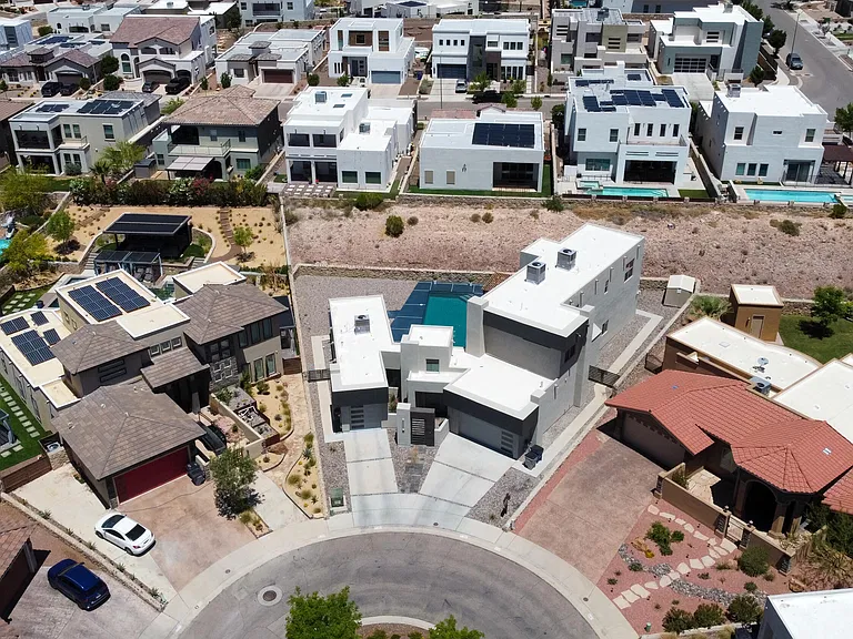 Original aerial photo centered over the cul-de-sac and the front of the home